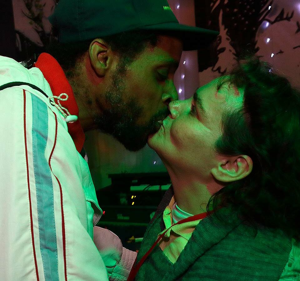 Woman and man kissing in disco