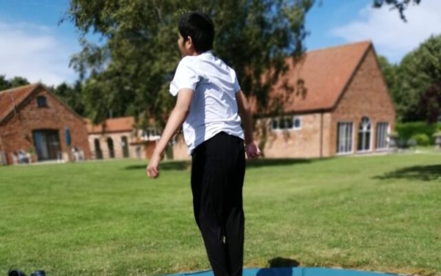 Young girl on trampoline