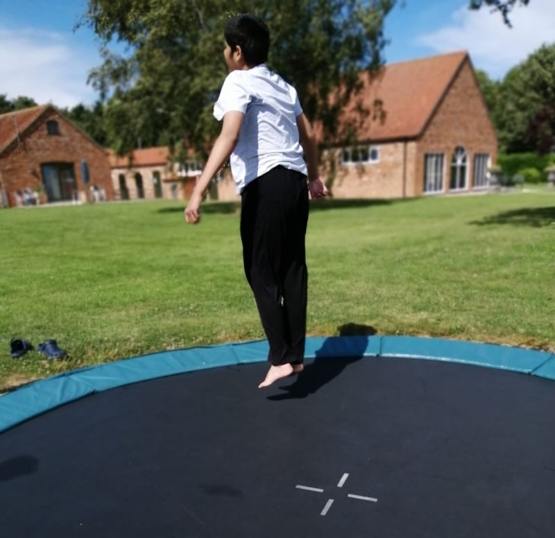 Young girl on trampoline