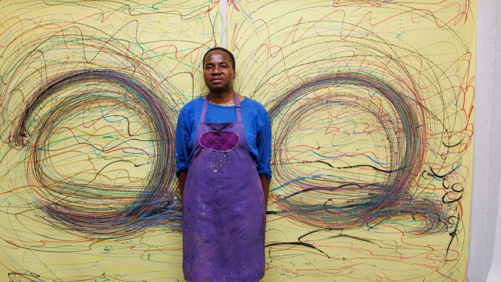 Nnena Kalu in front of a picture