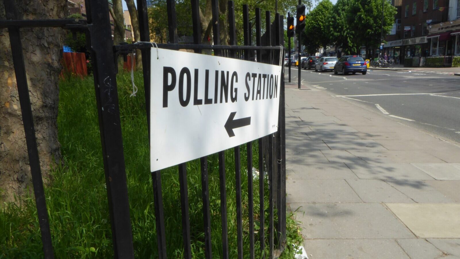 Pollig Station sign on fence