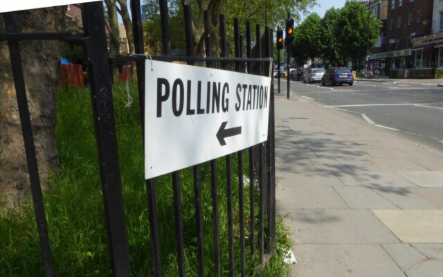 Pollig Station sign on fence