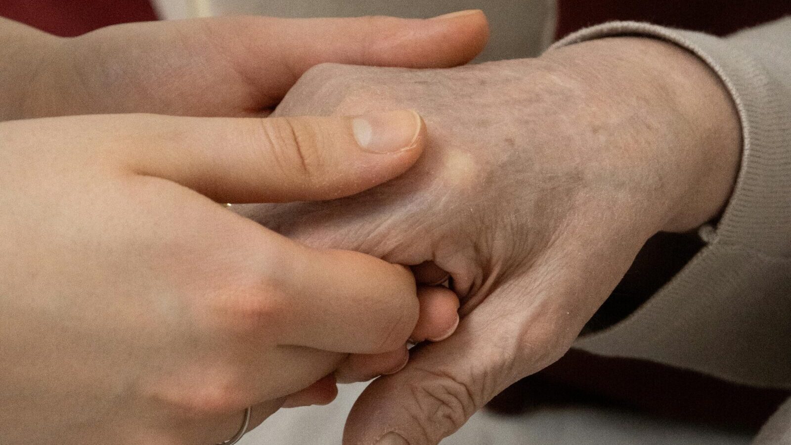 Holding hand of elderly person