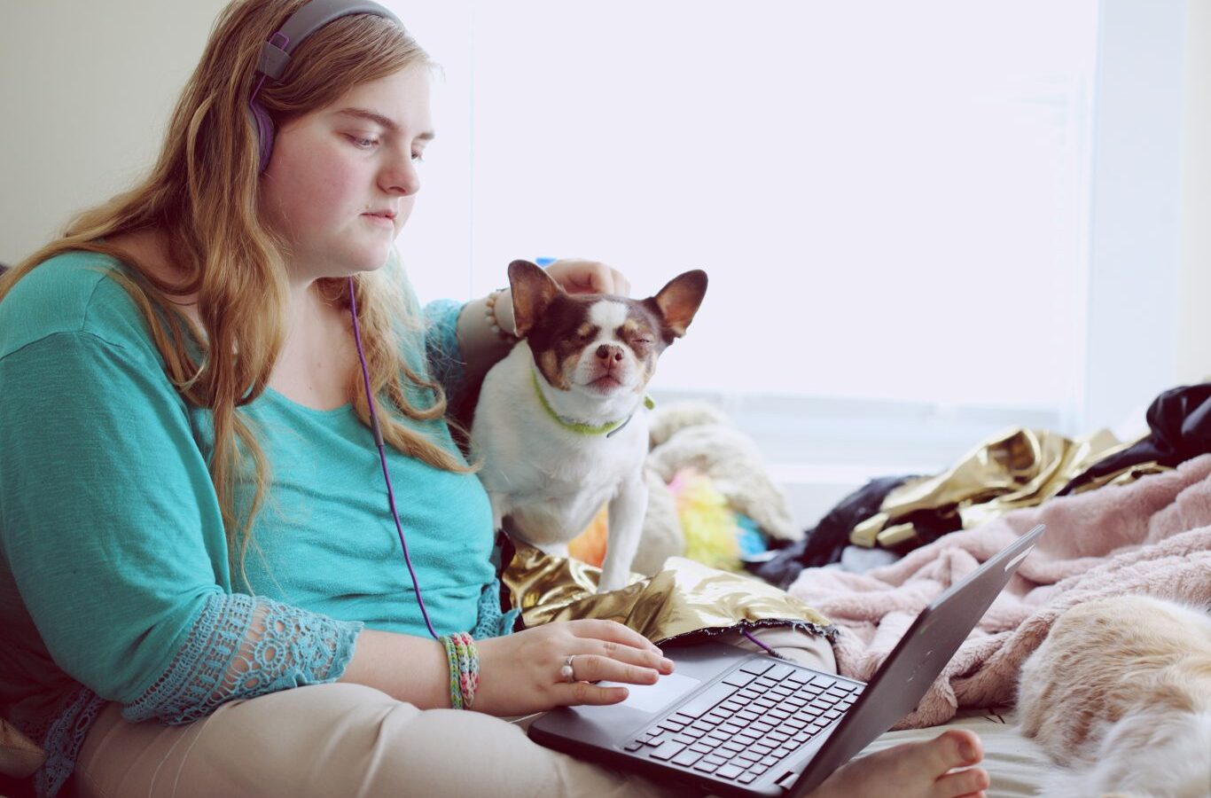 Woman with dog and laptop